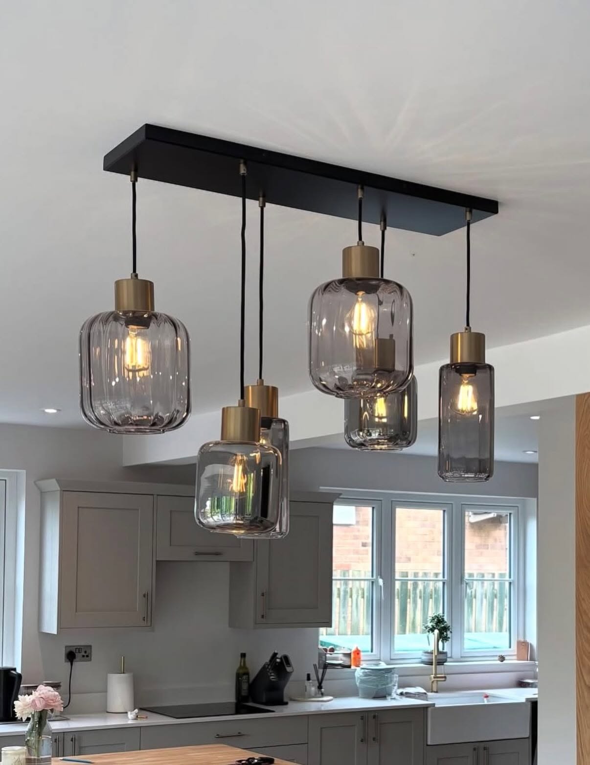 Kitchen pendant lighting with brass fittings installed by Northants Electrical Co
