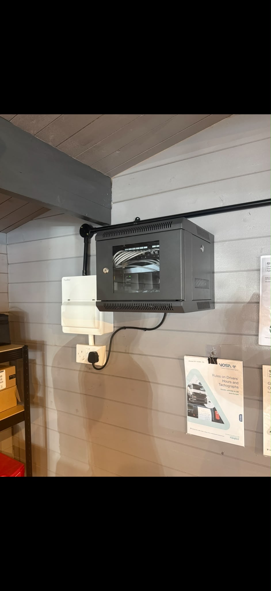 Wall mounted comms cabinet and consumer unit installed in a rural business park office