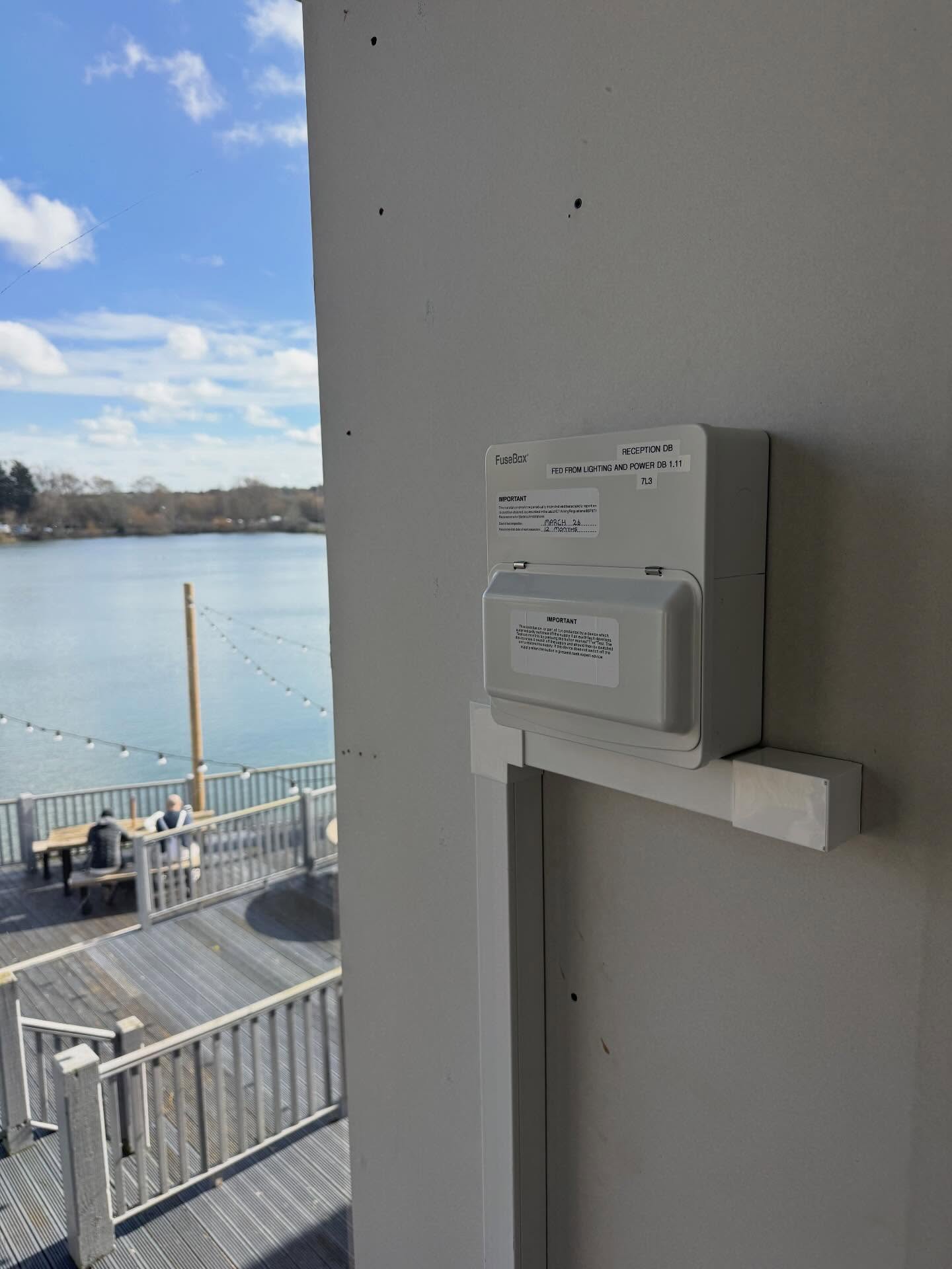 Distribution board with inspection labelling at a lakeside holiday park reception building